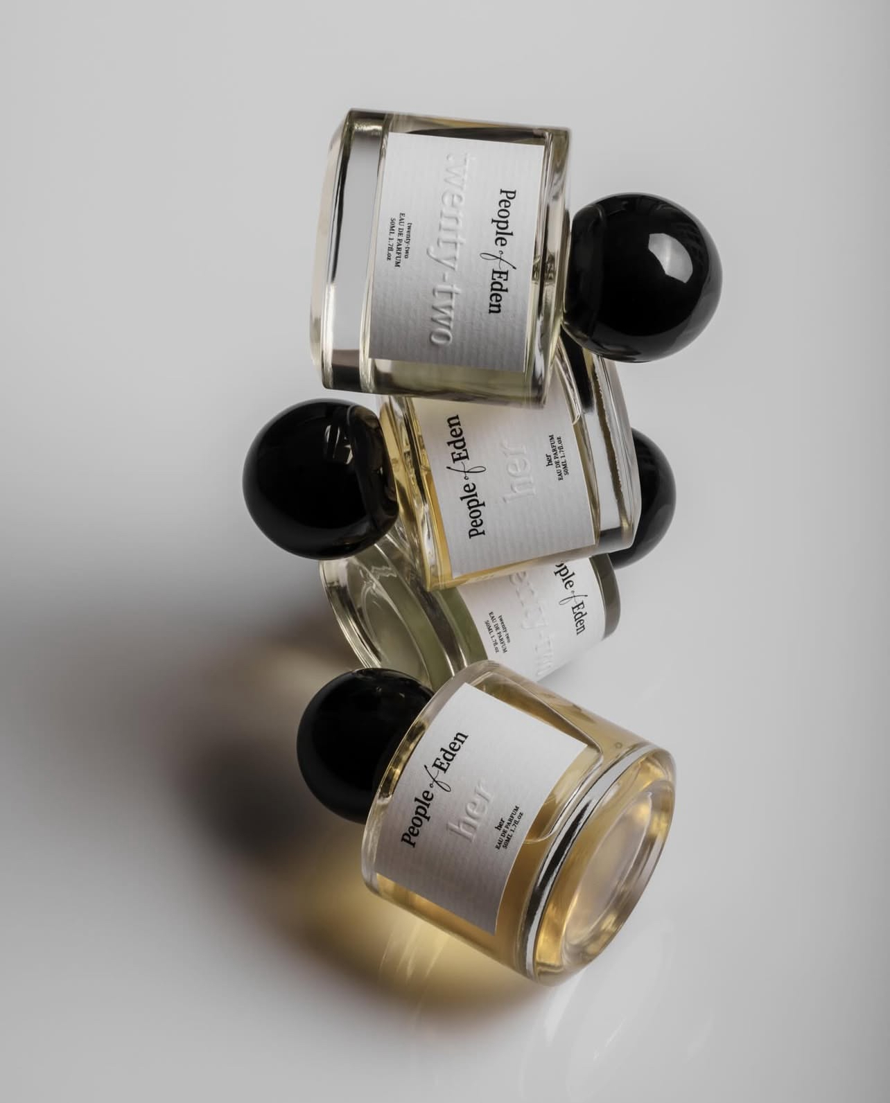 People of Eden perfume bottles in a flat-lay arrangement